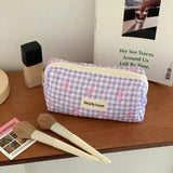Die gesteppte Tragetasche "Coquette-Charm": Süße Make-up-Tasche mit Schleifenmuster