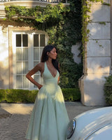 The "Aura Cotton" Midi: A Daring Backless Halter with a Seductive Low-Waist A-Line Flare