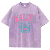 Das Malibu Retro T-Shirt: Sun-Washed Baumwoll-Grafik-T-Shirt mit Vintage-Schriftzug