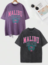 Das Malibu Retro T-Shirt: Sun-Washed Baumwoll-Grafik-T-Shirt mit Vintage-Schriftzug