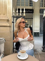 Women’s Ruffle Hem White Tank Top | Sexy Sleeveless V-Neck Crop Top