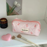 Die gesteppte Tragetasche "Coquette-Charm": Süße Make-up-Tasche mit Schleifenmuster